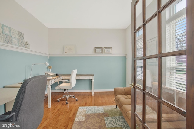 office area featuring light hardwood / wood-style floors and plenty of natural light