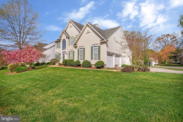 front facade with a front yard and a garage