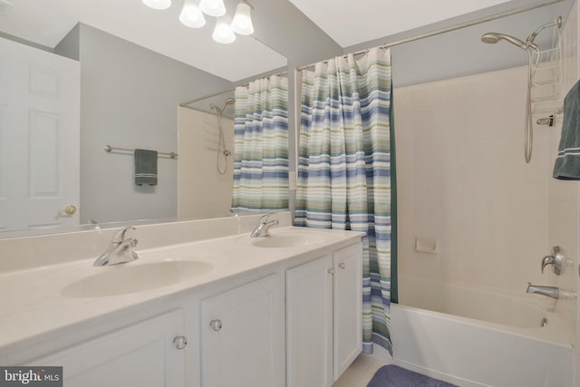 bathroom featuring vanity, shower / bath combo, and tile patterned flooring