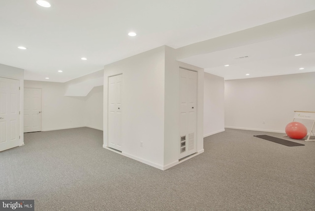 basement featuring carpet flooring