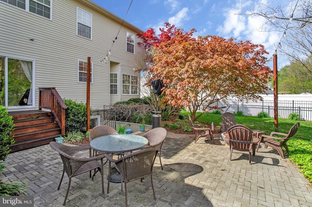 view of patio with an outdoor fire pit