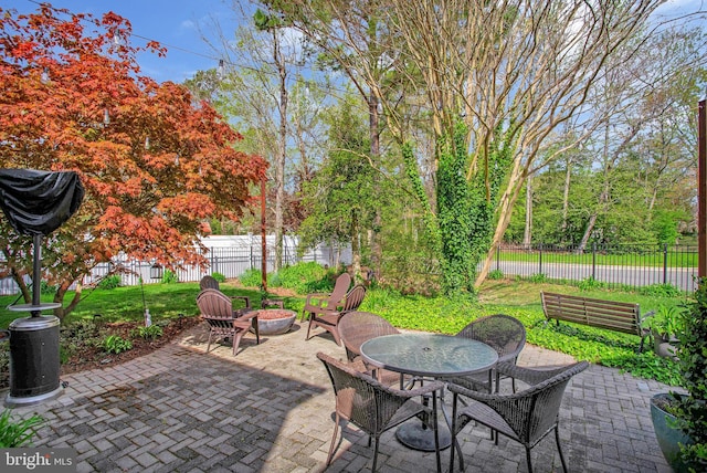 view of patio / terrace with a fire pit