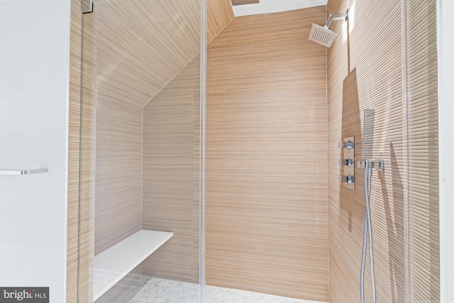 bathroom with a tile shower