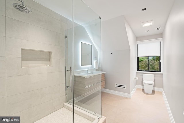 full bath featuring vanity, visible vents, baseboards, a shower stall, and toilet