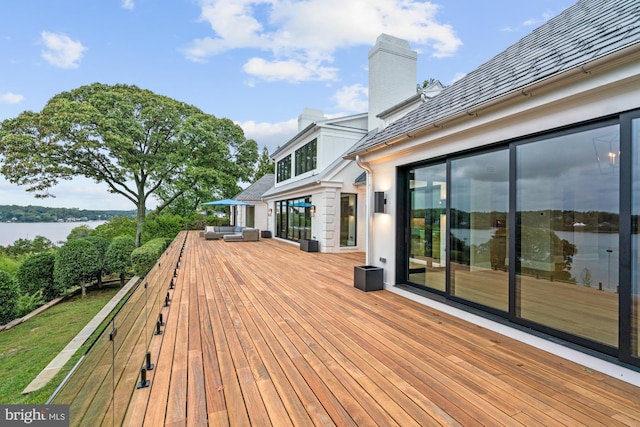 wooden terrace with a water view