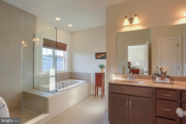 bathroom with vanity, plus walk in shower, and tile patterned floors