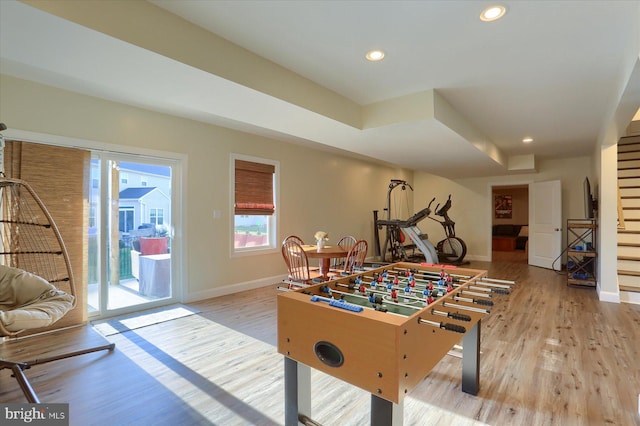 game room with light hardwood / wood-style flooring