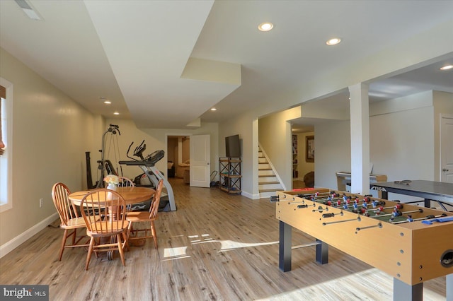 rec room with light hardwood / wood-style flooring