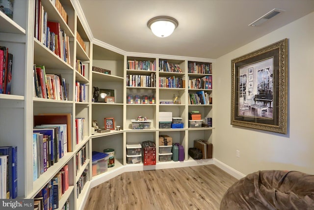 sitting room featuring wood-type flooring