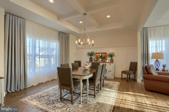 dining space featuring a notable chandelier, light hardwood / wood-style floors, and plenty of natural light