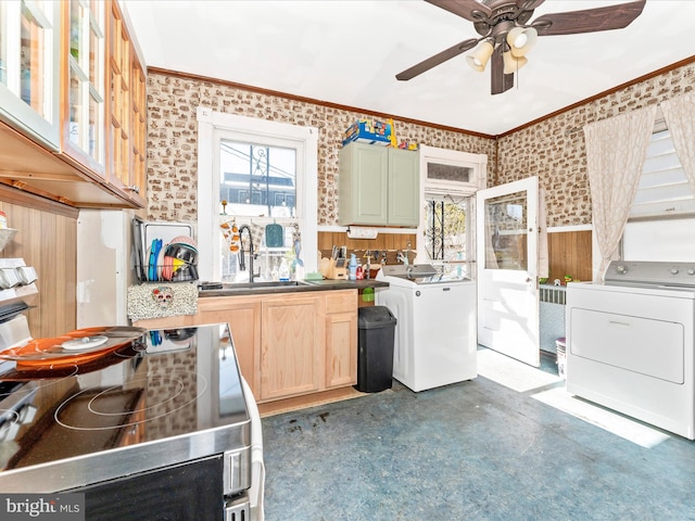 kitchen with crown molding, green cabinetry, ceiling fan, and washer / clothes dryer