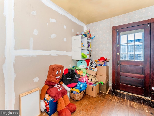 interior space featuring crown molding and dark hardwood / wood-style floors