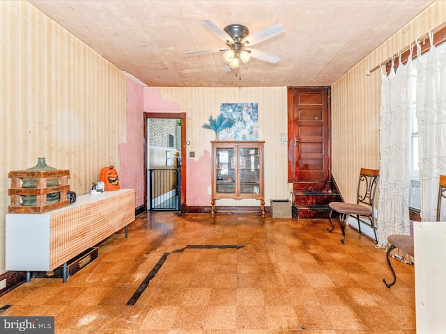 living area featuring ceiling fan