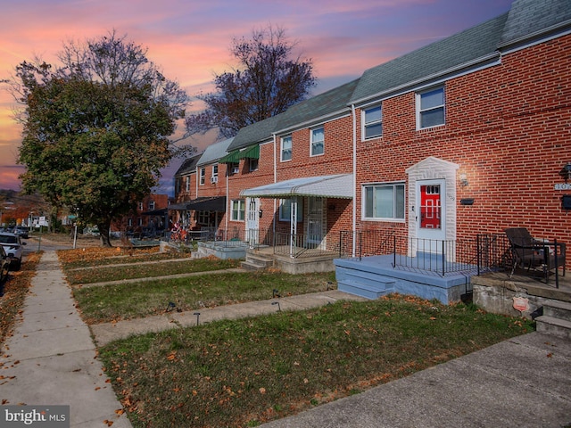 view of property featuring a yard