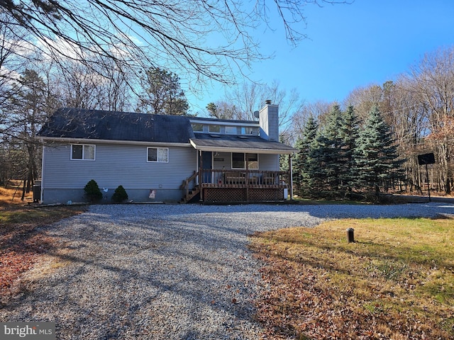 view of front of house with a deck and central AC unit