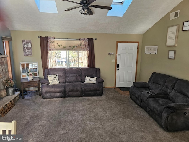 carpeted living room featuring lofted ceiling, a textured ceiling, and ceiling fan