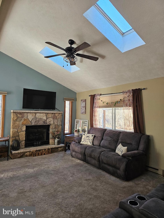 living room with a stone fireplace, lofted ceiling, a textured ceiling, and carpet floors