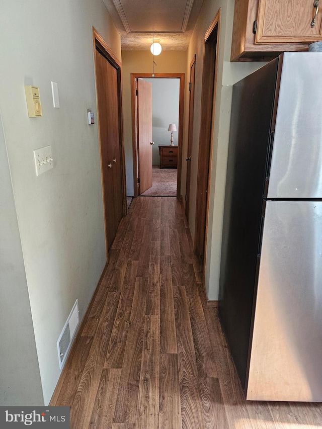 hallway featuring dark hardwood / wood-style floors