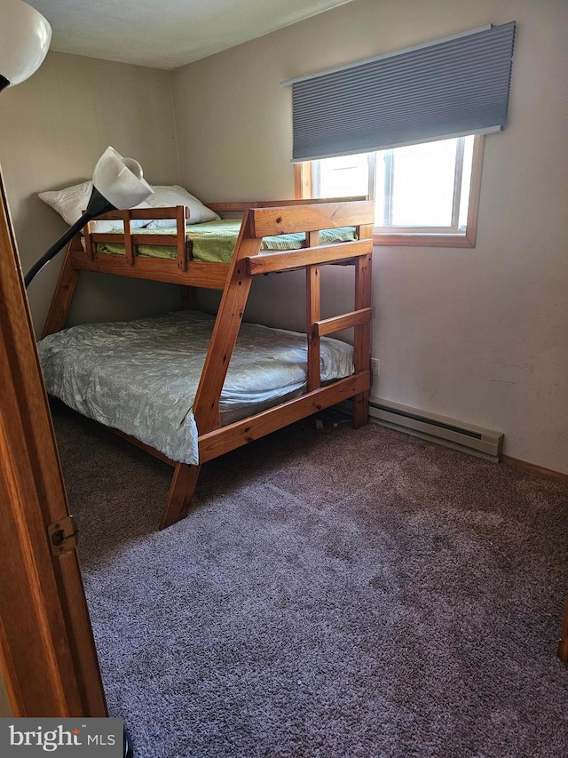 carpeted bedroom with a baseboard radiator