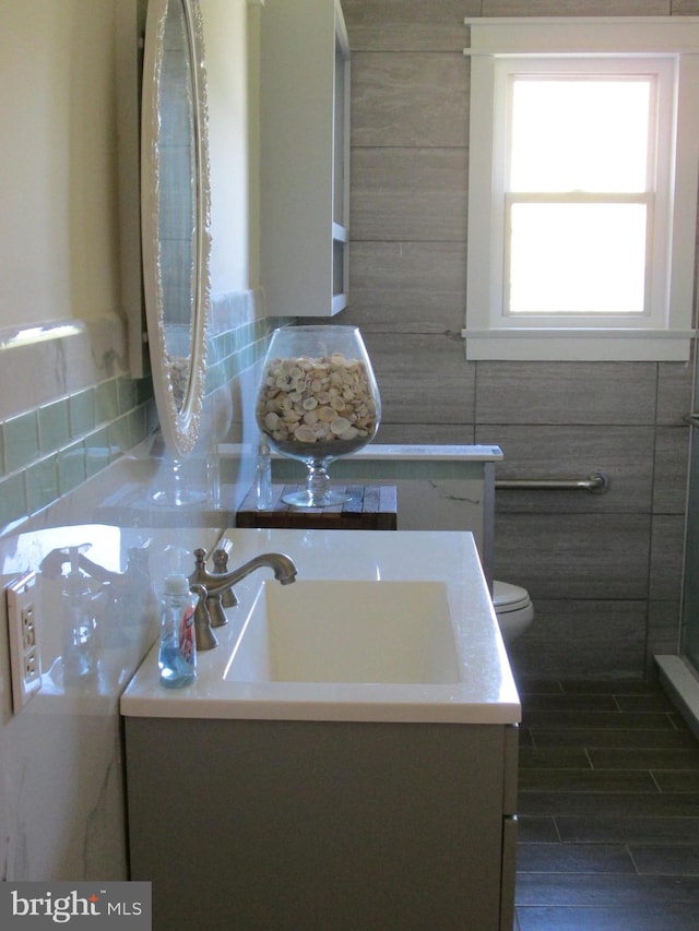 bathroom featuring vanity and toilet