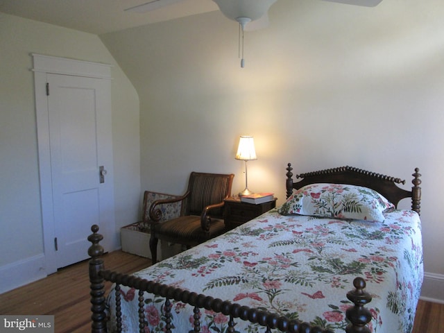 bedroom with ceiling fan and dark hardwood / wood-style flooring