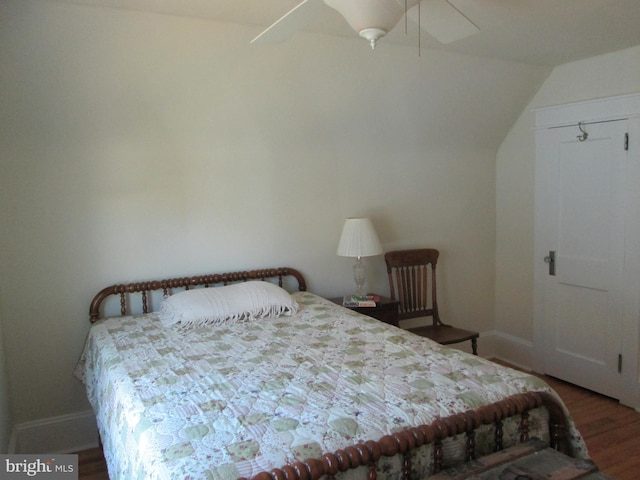 bedroom with ceiling fan and dark hardwood / wood-style flooring