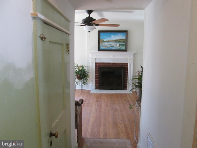 hallway with light hardwood / wood-style flooring