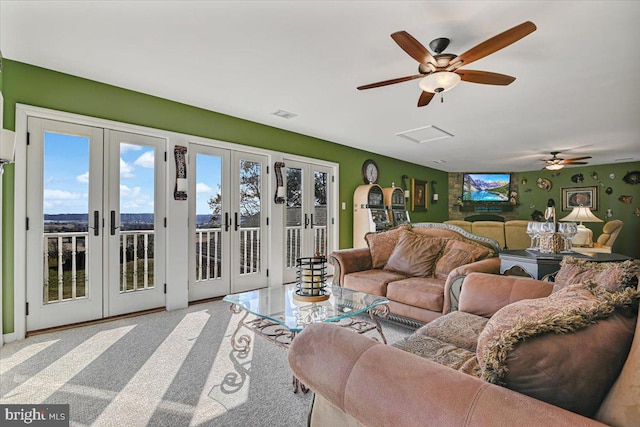 living room with ceiling fan and french doors