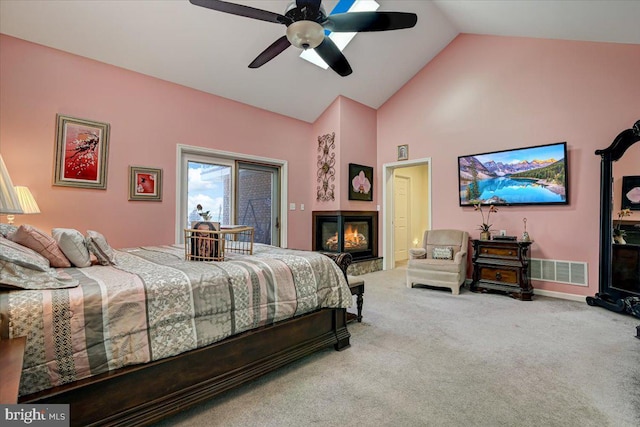 bedroom featuring ceiling fan, carpet, and lofted ceiling