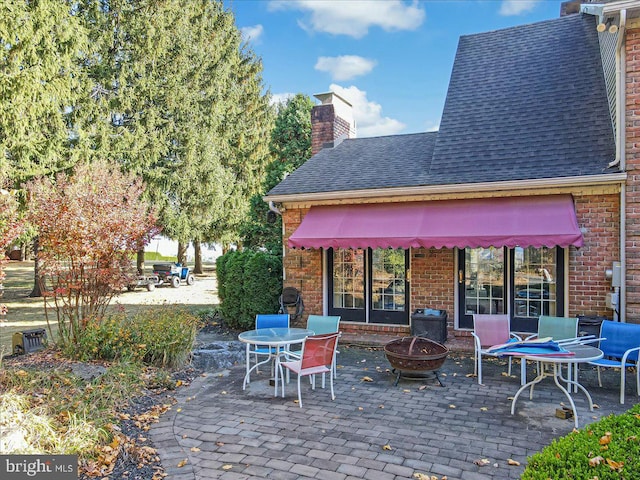 view of patio / terrace with an outdoor fire pit