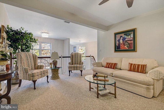 living room with beamed ceiling and ceiling fan