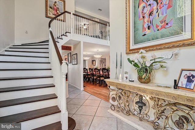 stairs featuring tile patterned flooring