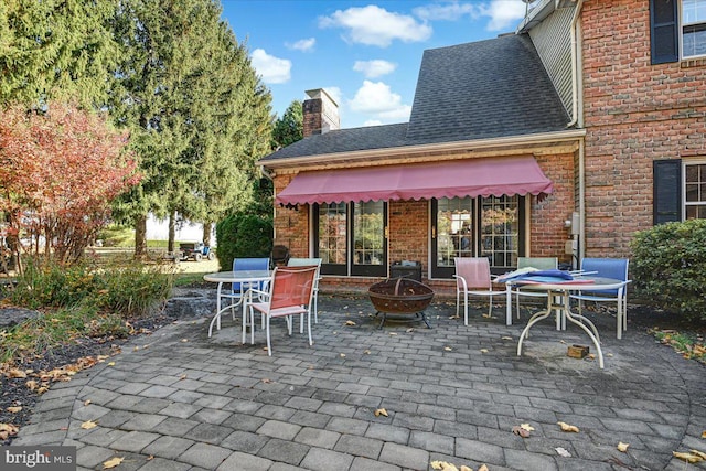 view of patio featuring an outdoor fire pit