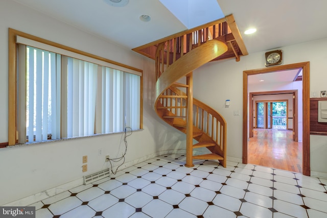 foyer entrance with light hardwood / wood-style flooring