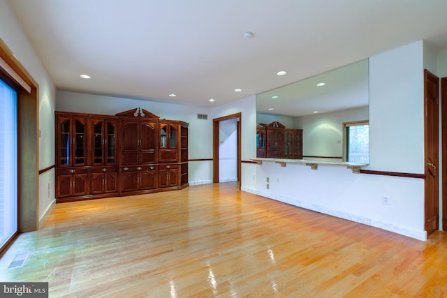 unfurnished living room with light wood-type flooring