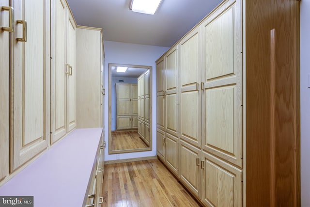 hall with light hardwood / wood-style floors