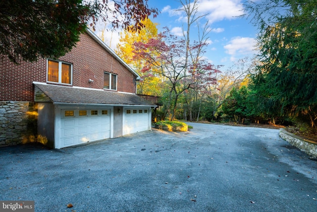 view of side of property featuring a garage