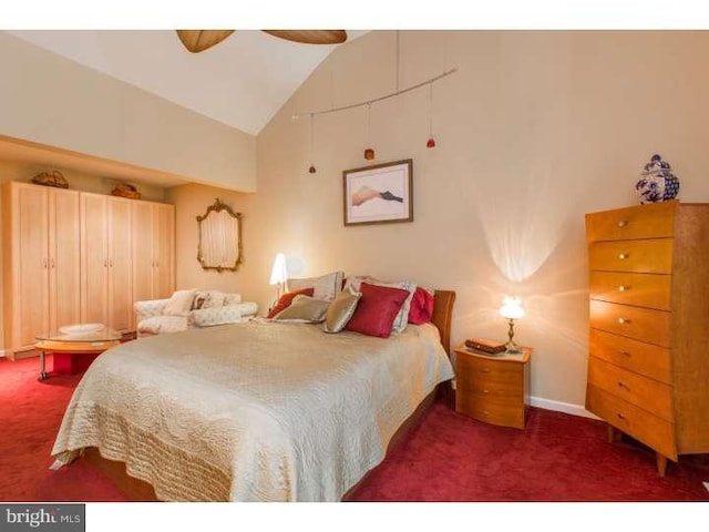 carpeted bedroom featuring ceiling fan and lofted ceiling