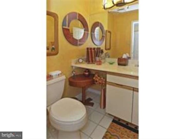 bathroom featuring toilet and tile patterned floors