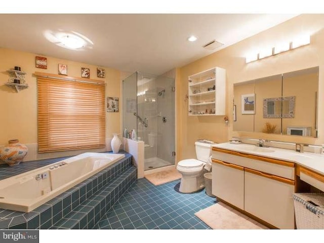 full bathroom with vanity, toilet, and separate shower and tub