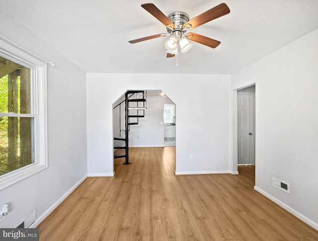 interior space featuring light wood-type flooring and ceiling fan