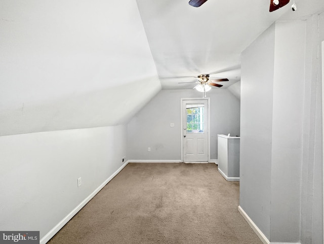 bonus room featuring carpet and vaulted ceiling