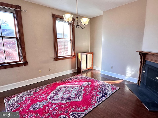 interior space featuring dark hardwood / wood-style floors and a chandelier