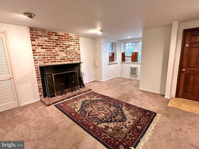 unfurnished living room featuring a fireplace, baseboards, and carpet floors