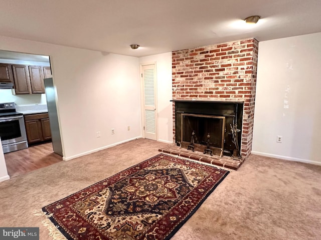 carpeted living room with a fireplace