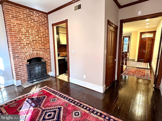 unfurnished living room featuring dark wood-type flooring and crown molding