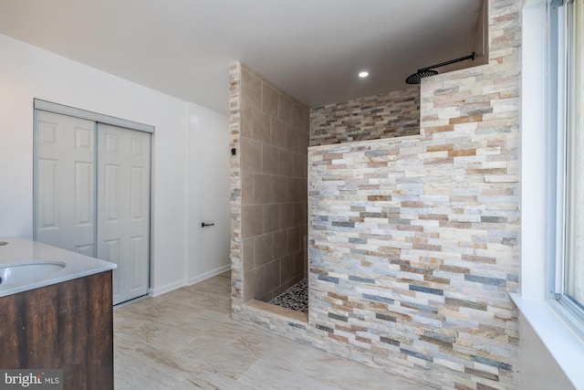 bathroom featuring vanity and a shower