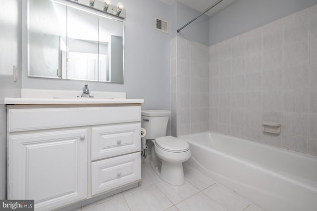 full bathroom with toilet, vanity, and tile patterned floors