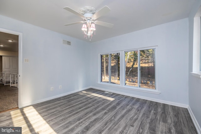 unfurnished room featuring ceiling fan and dark hardwood / wood-style floors