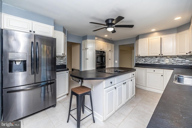 kitchen featuring black appliances, white cabinetry, backsplash, and light tile patterned floors